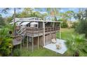 Elevated home with large deck and patio area, perfect for relaxing at 39200 Cook Brown Rd, Punta Gorda, FL 33982