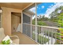Spacious screened balcony with seating and a view at 5261 Mahogany Run Ave # 624, Sarasota, FL 34241