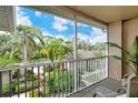 Relaxing screened balcony overlooking lush landscaping and a tranquil view at 5261 Mahogany Run Ave # 624, Sarasota, FL 34241