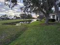 Peaceful view of a pond and golf course at 5492 Hampstead Heath # 11, Sarasota, FL 34235