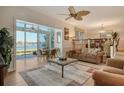 Spacious living room with water views and comfortable furniture at 6047 E Peppertree Way # 224, Sarasota, FL 34242