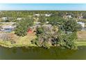 Aerial view showcasing a lakefront property and neighborhood at 6300 26Th E Ave, Bradenton, FL 34208