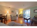 Bright living room with hardwood floors and comfy seating at 6304 Pointe West Blvd # A306, Bradenton, FL 34209