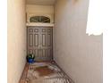 Front entry with double doors and a tropical-themed mat at 6422 42Nd E St, Sarasota, FL 34243