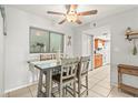 Dining area with table and chairs, view to kitchen at 6703 Midnight Pass Rd # 108B, Sarasota, FL 34242