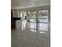 Kitchen with island and access to pool area at 732 Tuxford Dr, Sarasota, FL 34232