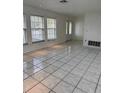 Bright living room with tile flooring and large windows at 732 Tuxford Dr, Sarasota, FL 34232