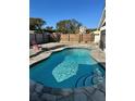 Inviting kidney-shaped pool with flagstone patio at 732 Tuxford Dr, Sarasota, FL 34232