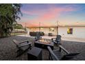 Relaxing backyard with fire pit and seating area, perfect for outdoor gatherings at 8204 Constance Dr, Sarasota, FL 34243