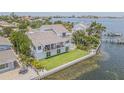 Waterfront property featuring a modern home and expansive backyard at 970 Boca Ciega Isle Dr, St Pete Beach, FL 33706