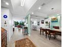 Bright dining room with hardwood floors and access to kitchen and living areas at 1255 N Gulfstream Ave # 204, Sarasota, FL 34236