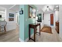 Entryway with light walls, hardwood floors, and access to living and dining areas at 1255 N Gulfstream Ave # 204, Sarasota, FL 34236