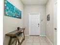 Bright entryway with a console table and neutral color scheme at 14339 Easy Goer St, Ruskin, FL 33573