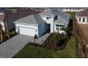 One-story house with gray roof and a landscaped yard, viewed from above at 16415 Isola Pl, Bradenton, FL 34211