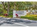 Welcoming entryway to Wildwood Springs community at 277 Sherwood Dr # 277D, Bradenton, FL 34210