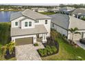 House with a gray roof and brown garage door at 3704 Wild Blossom Pl, Parrish, FL 34219