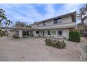 Building exterior showcasing unique architectural details and landscaping at 3712 Sandspur Ln, Nokomis, FL 34275