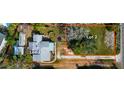 Aerial view highlighting a house and two separate vacant lots at 4420 102Nd W St, Bradenton, FL 34210