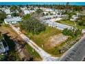 Aerial view of vacant land with nearby houses and mobile homes at 4420 102Nd W St, Bradenton, FL 34210