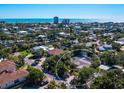 Aerial view showcasing the home's location in a residential neighborhood near the ocean at 5140 Windward Ave, Sarasota, FL 34242