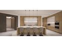 Modern kitchen with island and stainless steel appliances at 555 Quay Cmn # 1103, Sarasota, FL 34236
