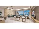 Spacious living room with water views and modern furniture at 555 Quay Cmn # 1103, Sarasota, FL 34236