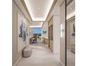 Bright and spacious entryway with modern design, showcasing a view to the dining area and wet bar at 555 Quay Cmn # 1105, Sarasota, FL 34236