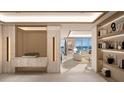 Light-filled entryway with built-in shelving and modern console at 555 Quay Commons # 402, Sarasota, FL 34236