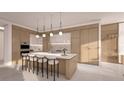 Modern kitchen with island and stainless steel appliances at 555 Quay Commons # 402, Sarasota, FL 34236