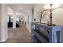 Neutral-toned hallway with contemporary console table at 5817 Hevena Ct, Palmetto, FL 34221
