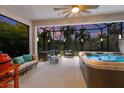Relaxing screened patio with hot tub and comfortable seating at 5817 Hevena Ct, Palmetto, FL 34221