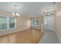 Empty dining room featuring hardwood floors and neutral walls at 9423 Sarazen Pl, Palmetto, FL 34221