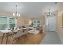 Bright dining room with hardwood floors and staged furniture at 9423 Sarazen Pl, Palmetto, FL 34221