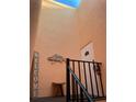 Welcoming entryway with a wooden bench and beach-themed wall art at 117 10Th N St # 122, Bradenton Beach, FL 34217