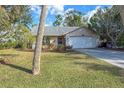 Well-maintained house with a large green lawn at 1204 W 20Th Ave, Palmetto, FL 34221