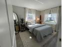 Bright bedroom with a comfortable bed and large windows at 2510 Parma St, Sarasota, FL 34231