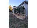 Landscaped yard with bushes and rock features at 2537 Tishman Ave, North Port, FL 34286