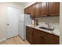 Updated kitchen featuring wood cabinets and new appliances at 2764 Hidden Lake Blvd # 2764, Sarasota, FL 34237