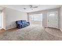 Living room with blue couch and bay window at 3231 Yorktown St, Sarasota, FL 34231