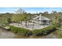 Waterfront property with private dock and lush landscaping at 4027 Siren Rd, Venice, FL 34293