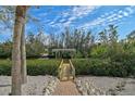 Wooden walkway leads to a private dock on the water at 4027 Siren Rd, Venice, FL 34293