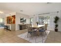 Bright dining room featuring a light wood table and six chairs at 418 Sarabay Rd, Osprey, FL 34229