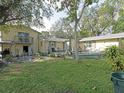 Spacious backyard deck that is perfect for outdoor entertaining with seating and relaxing at 5411 9Th E St, Bradenton, FL 34203