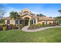 Luxury home showcasing a beautiful facade and a well-manicured lawn at 6919 Winners Cir, Lakewood Ranch, FL 34202