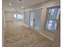 Bright entryway with light wood flooring leading to other rooms at 7 Oakland Hills Pl, Rotonda West, FL 33947