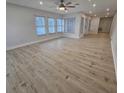 Spacious living room featuring light wood flooring and lots of natural light at 7 Oakland Hills Pl, Rotonda West, FL 33947