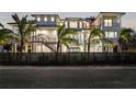 Luxury beachfront home illuminated at night, showcasing its architecture at 7007 Point Of Rocks Rd, Sarasota, FL 34242