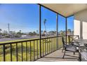 Screened balcony overlooking the beach and ocean at 757 Beach Rd # 208, Sarasota, FL 34242