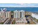 Drone view showcasing a condo building near the waterfront at 800 N Tamiami Trl # 1502, Sarasota, FL 34236