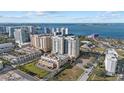 Condo building with a pool and beautiful waterfront views at 800 N Tamiami Trl # 1502, Sarasota, FL 34236